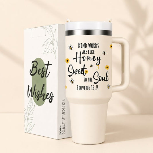 White travel mug with motivational quote and packaging on a beige background