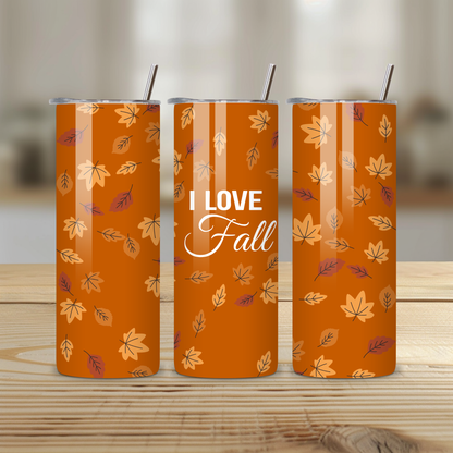 Three orange tumblers with leaf patterns and 'I Love Fall' text on a wooden surface.