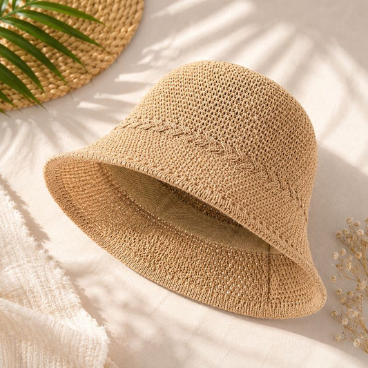 Beige woven bucket hat on a light background with natural elements-Designs by Berniemae